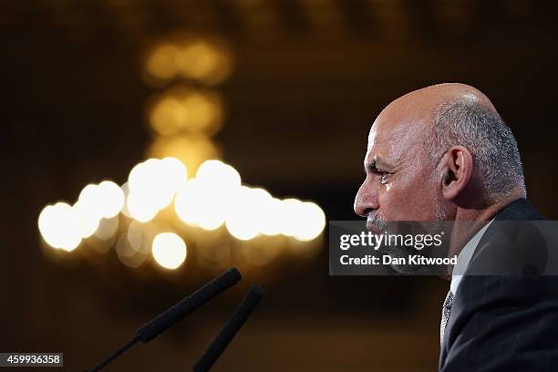 Afghanistan's President Ashraf Ghani speaks to delegates and ministers during the London Conference on Afghanistan in central London on December 4,...