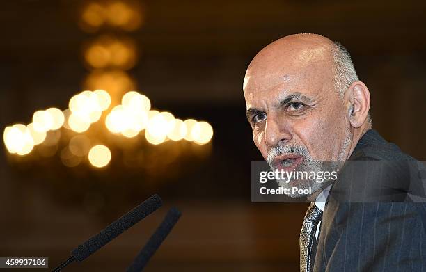 Afghanistan's President Ashraf Ghani speaks to delegates and ministers during the London Conference on Afghanistan in central London on December 4,...