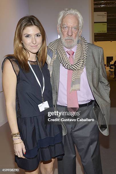 Actor Donald Sutherland and guest attend Art Basel Miami Beach 2014 - VIP Preview at the Miami Beach Convention Center on December 4, 2014 in Miami...