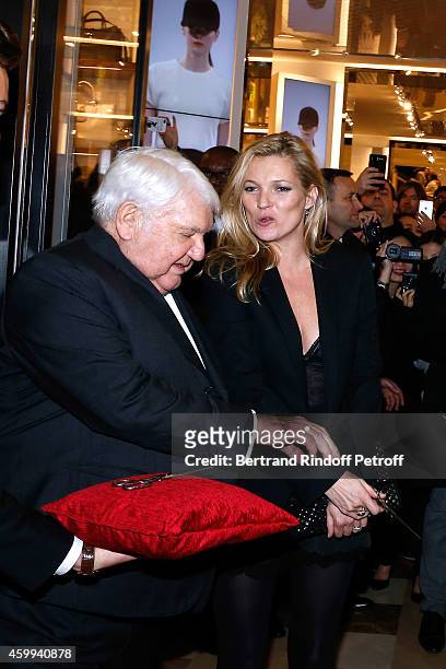 Owner of Longchamp Philippe Cassegrain and Model Kate Moss attend the Longchamp Elysees "Lights On Party" Boutique Launch on December 4, 2014 in...