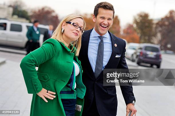 Reps. Kyrsten Sinema, D-Ariz., and Aaron Schock, R-Ill., say goodbye after at the bottom of the House Steps after the last vote of the week in the...