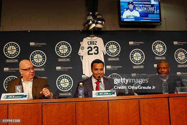 Jack Zduriencik, Nelson Cruz, and manager Lloyd McClendon of the Seattle Mariners speak to the media during Cruz's introductory press conference at...