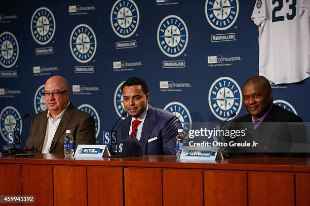 Jack Zduriencik, Nelson Cruz, and manager Lloyd McClendon of the Seattle Mariners speak to the media as Cruz is introduced during a press conference...