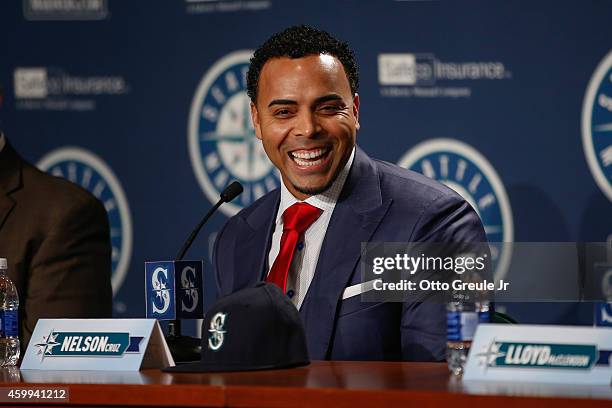 Nelson Cruz of the Seattle Mariners speaks to the media at his introductory press conference at Safeco Field on December 4, 2014 in Seattle,...