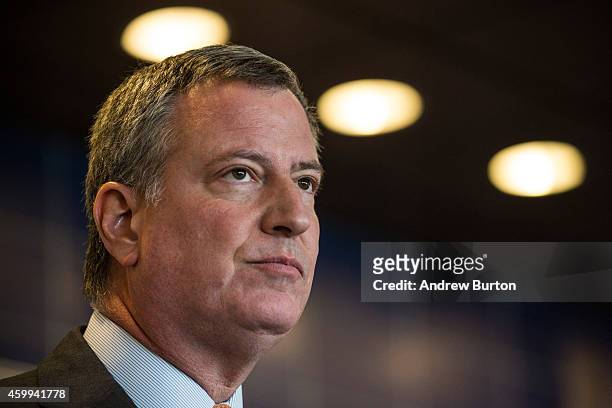 New York City Mayor Bill de Blasio speaks at a press conference after witnessing police being retrained with new guidelines at the Police Academy on...