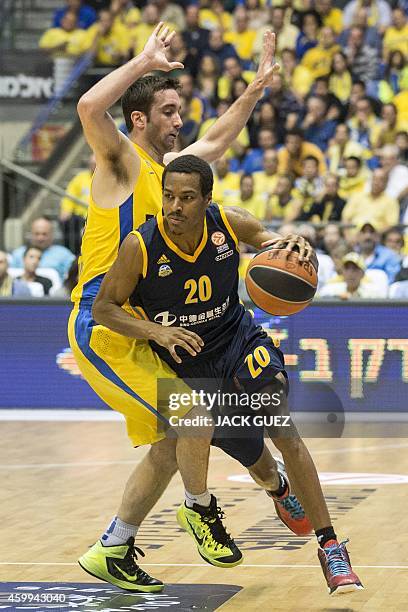 Alba Berlin's US guard Alex Renfroe vies with Maccabi Electra Tel Aviv's Israeli forward Jake Cohen during their group B Euroleague basketball match...