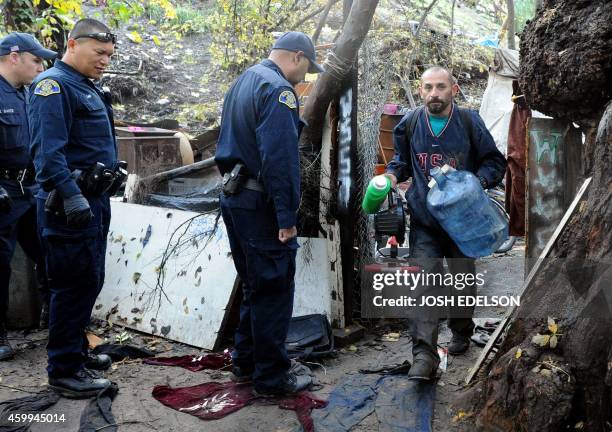 San Jose police tell two-year resident Johnny Valenzuela to vacate his dwelling at a Silicon Valley homeless encampment known as The Jungle on...