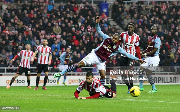 Leandro Bacuna of Aston Villa is blocked by Ondrej Celustka of Sunderland during the Barclays Premier League match between Sunderland and Aston Villa...