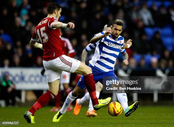 Danny Williams of Reading tackles Greg Halford of Nottingham Forest during the Sky Bet Championship match between Reading and Nottingham Forest at...