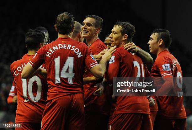 Daniel Agger of Liverpool celebrates his goal during the Barclays Premier League match between Liverpool and Hull City at Anfield on January 1, 2014...