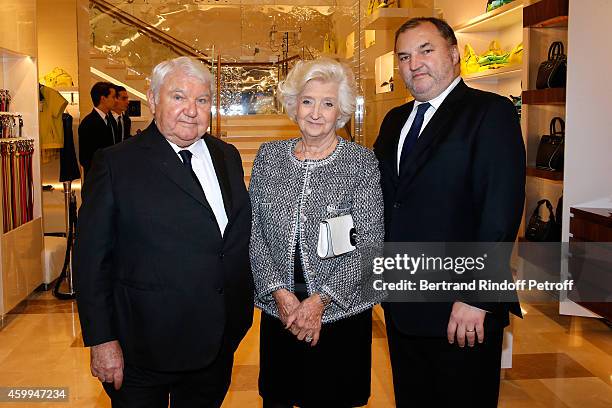Ownr of Longchamp Philippe Cassegrain, his wife Michele Cassegrain and their son US Head of Retail Olivier Cassegrain attend the Longchamp Elysees...