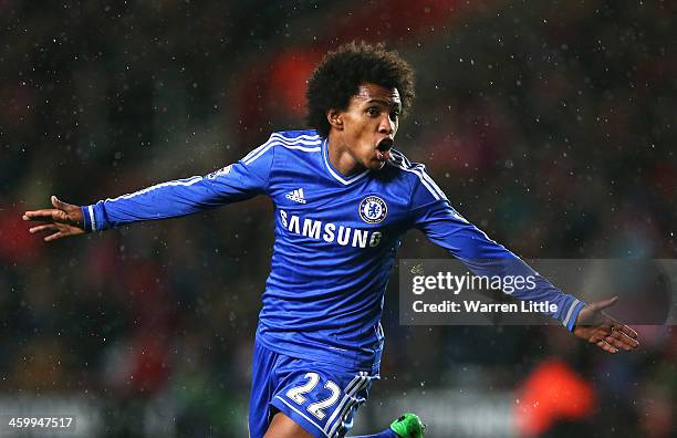 Willian of Chelsea celebrates after scoring his team's second goal during the Barclays Premier League match between Southampton and Chelsea at St...