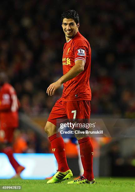 Luis Suarez of Liverpool smiles during the Barclays Premier League match between Liverpool and Hull City at Anfield on January 1, 2014 in Liverpool,...