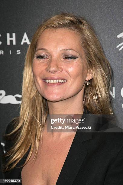 Kate Moss attends the 'Longchamp' Elysees lights on Party photocall at Longchamp Boutique Champs-Elysees on December 4, 2014 in Paris, France.