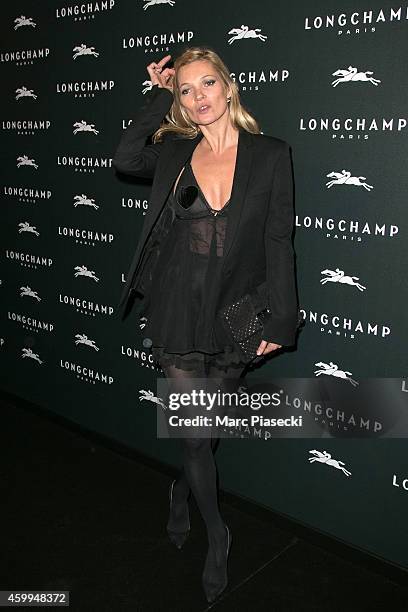 Kate Moss attends the 'Longchamp' Elysees lights on Party photocall at Longchamp Boutique Champs-Elysees on December 4, 2014 in Paris, France.