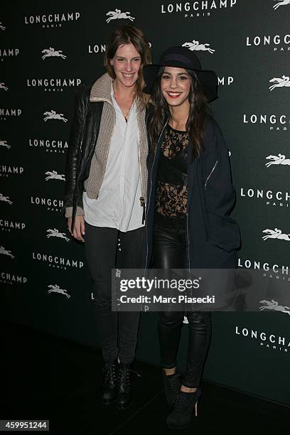 Actresses Juliette Dol and Alice Belaidi attend the 'Longchamp' Elysees lights on Party photocall at Longchamp Boutique Champs-Elysees on December 4,...