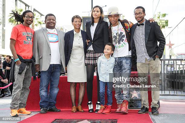 Singer-Songwriter Pharrell Williams and family attend the ceremony honoring Pharrell Williams with a star on the Hollywood Walk of Fame on December...
