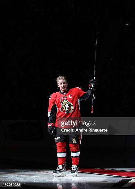 Upon signing a one day contract to retire with the NHL team he played 17 years with, Daniel Alfredsson of the Ottawa Senators salutes the fans during...