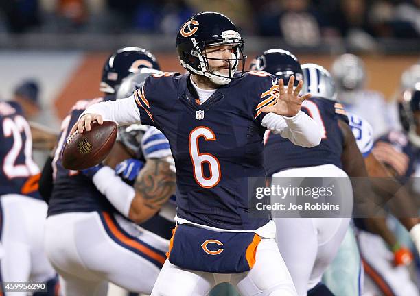 Jay Cutler of the Chicago Bears passes during the first quarter of a game against the Dallas Cowboys at Soldier Field on December 4, 2014 in Chicago,...