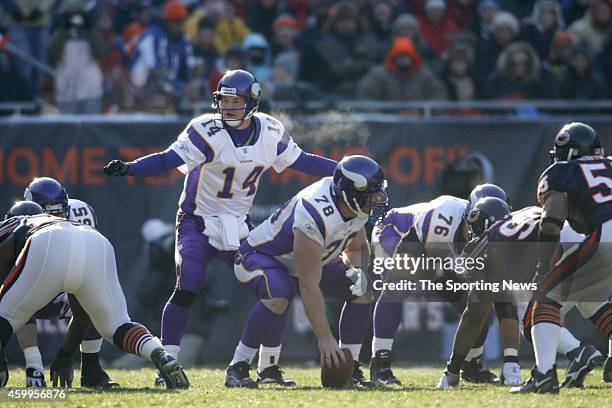 Matt Birk and Brad Johnson of the Minnesota Vikings at the line of scrimmage during a game against the Chicago Bears on December 3, 2006 at Soldier...