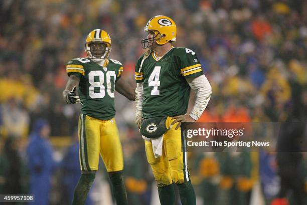Donald Driver and Brett Favre of the Green Bay Packers look on from the field during a game against the Minnesota Vikings on December 21, 2006 at...