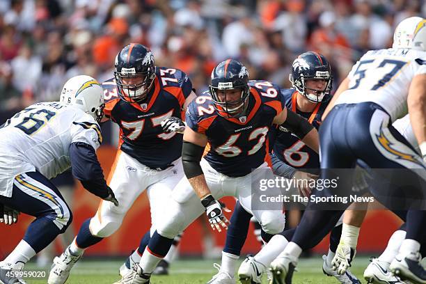 Chris Kuper and Casey Wiegmann of the Denver Broncos makes a block during a game against the San Diego Chargers on September 14, 2008 at Invesco...
