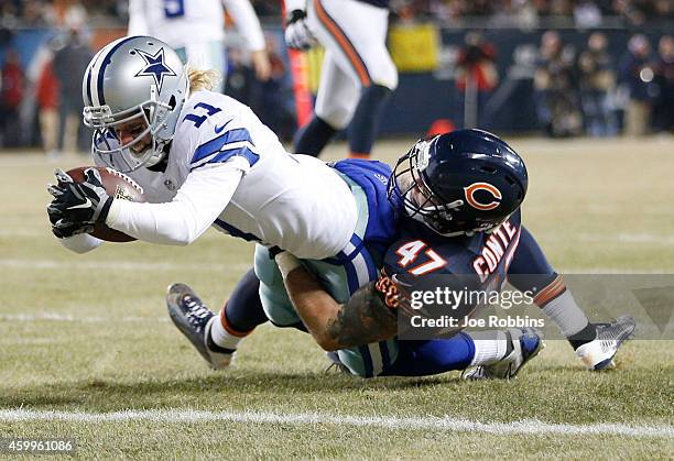 Cole Beasley of the Dallas Cowboys drives through Chris Conte of the Chicago Bears for a touchdown during the second quarter of a game at Soldier...