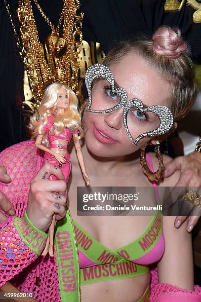 Miley Cyrus attends Jeremy Scott & Moschino Party with Barbie on December 4, 2014 in Miami Beach, Florida.