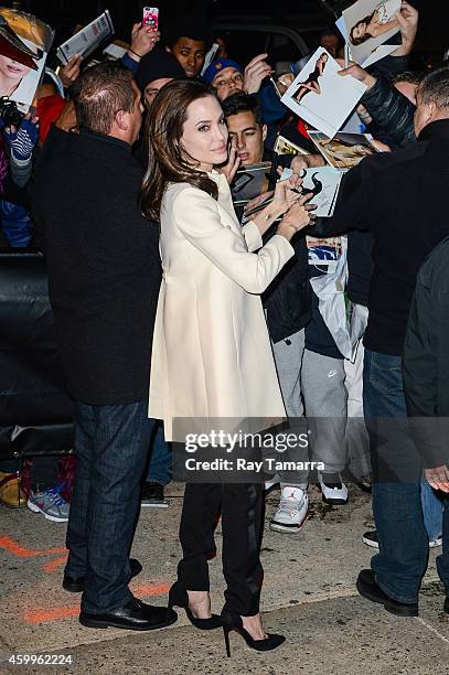 Actress Angelina Jolie enters the "Daily Show With Jon Stewart" taping at NEP Studio 52 on December 4, 2014 in New York City.