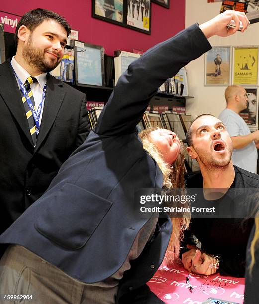 Matt Willis of McBusted meets fans and signs copies of their new self titled album at HMV Manchester on December 4, 2014 in Manchester, England.