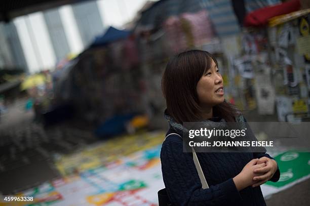 In this picture taken on December 4 artist Helen Fan, one of the founders of the online glossary Umbrella Terms, gestures at the main Admiralty...