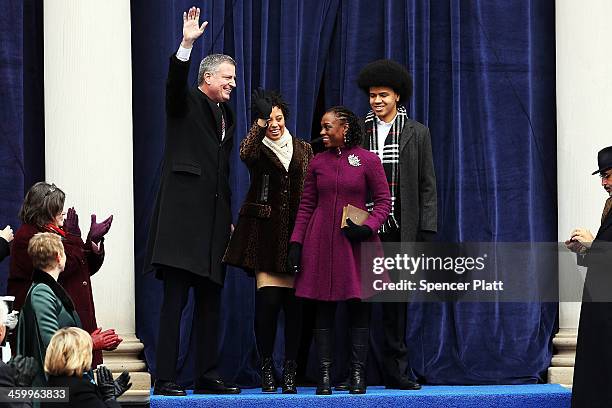 New York City's 109th Mayor Bill de Blasio walks onto stage with his family his family, Chiara de Blasio Dante de Blasio and wife Chirlane McCray at...