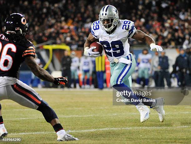 DeMarco Murray of the Dallas Cowboys runs the ball on Tim Jennings of the Chicago Bears during the third quarter a game at Soldier Field on December...