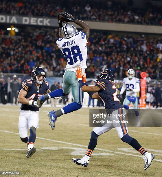 Dez Bryant of the Dallas Cowboys makes a catch between Chris Conte of the Chicago Bears and Kyle Fuller of the Chicago Bears during the third quarter...