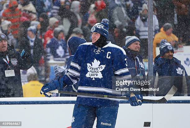 Dion Phaneuf of the Toronto Maple Leafs looks on during warm-up prior to the 2014 Bridgestone NHL Winter Classic on January 1, 2014 at Michigan...