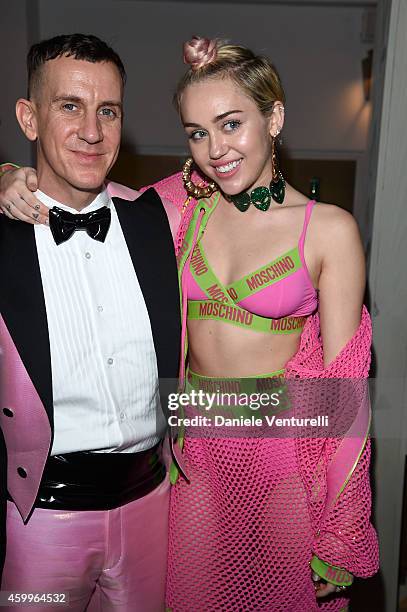 Miley Cyrus and Jeremy Scott attend Jeremy Scott & Moschino Party with Barbie on December 4, 2014 in Miami Beach, Florida.