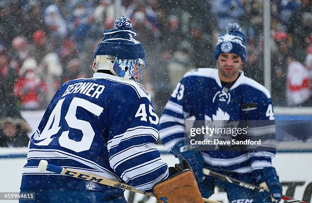 Goaltender Jonathan Bernier and Nazem Kadri of the Toronto Maple Leafs warm up prior to the 2014 Bridgestone NHL Winter Classic on January 1, 2014 at...