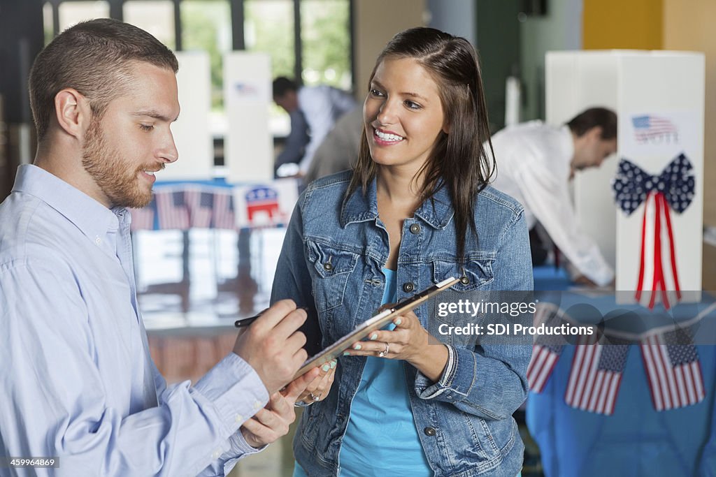 Woman taking exit poll interview on election day