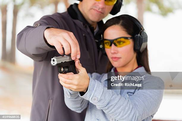 practicing at the shooting range - zelfverdediging stockfoto's en -beelden