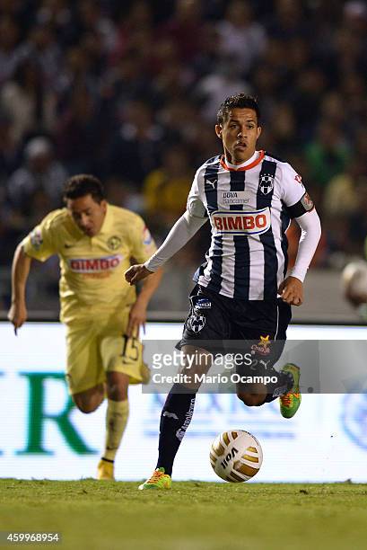 Severo Meza of Monterrey drives the ball during a semifinal first leg match between Monterrey and America as part of the Apertura 2014 Liga MX at...