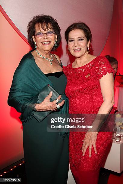 Claudia Cardinale, Hannelore Elsner during the Mon Cheri Barbara Tag 2014 at Haus der Kunst on December 4, 2014 in Munich, Germany.