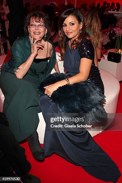 Claudia Cardinale and Monica Cruz during the Mon Cheri Barbara Tag 2014 at Haus der Kunst on December 4, 2014 in Munich, Germany.