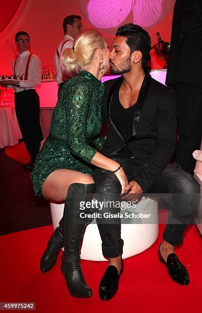 Sarah Kern and her fiance Alieu during the Mon Cheri Barbara Tag 2014 at Haus der Kunst on December 4, 2014 in Munich, Germany.