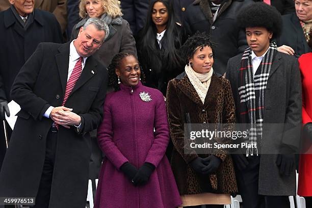 New York City's 109th Mayor Bill de Blasio stands on stage with his family Chiara de Blasio Dante de Blasio and wife Chirlane McCray at City Hall on...