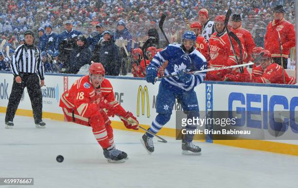 Nazem Kadri of the Toronto Maple Leafs shoots the puck past Joakim Andersson of the Detroit Red Wings into the Wings zone in the first period during...
