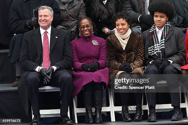 New York City's 109th Mayor Bill de Blasio sits on stage with his family Chiara de Blasio Dante de Blasio and wife Chirlane McCray at City Hall on...