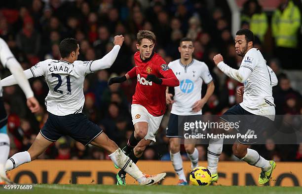 Adnan Januzaj of Manchester United in action with Vlad Chiriches and Mousa Dembele of Tottenham Hotspur during the Barclays Premier League match...