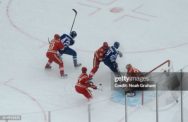 Goaltender Jimmy Howard and Kyle Quincey of the Detroit Red Wings defend their net as teammates Pavel Datsyuk and Danny DeKeyser defend Tyler Bozak...