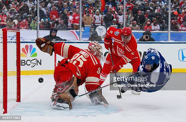 Goaltender Jimmy Howard of the Detroit Red Wings makes a save on a scoring attempt by Nazem Kadri of the Toronto Maple Leafs in the second period...