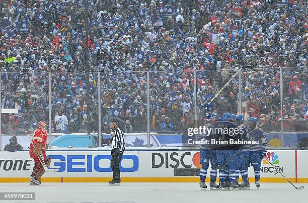 James van Riemsdyk of the Toronto Maple Leafs celebrates with teammates Carl Gunnarsson, Dion Phaneuf, Tyler Bozak and Phil Kessel after scoring in...